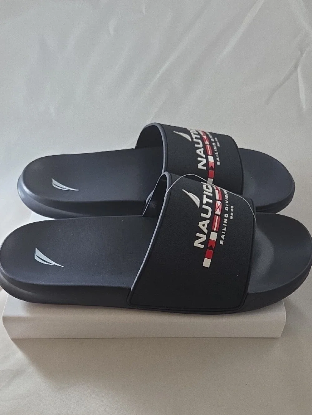 Nautica Black Slide Sandals with Red & White Sailing Division Logo